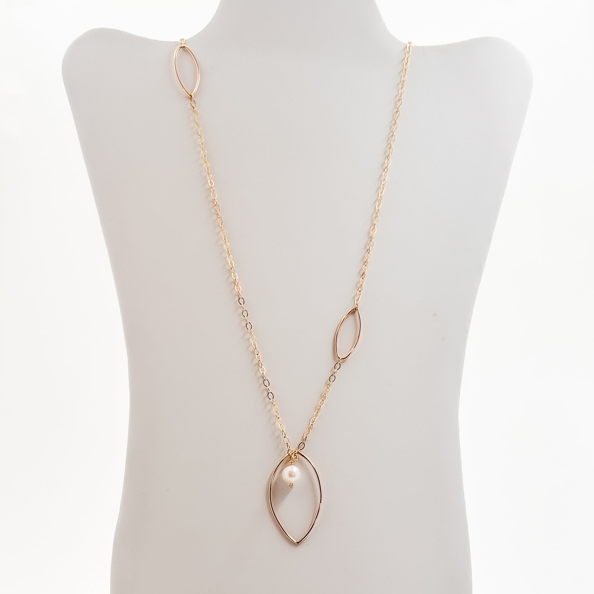 Long leaf lariat with white pearl necklace