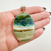 Bezel set large oval opalized wood pendant