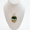 Bezel set large oval opalized wood pendant