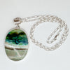 Bezel set large oval opalized wood pendant