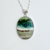 Bezel set large oval opalized wood pendant