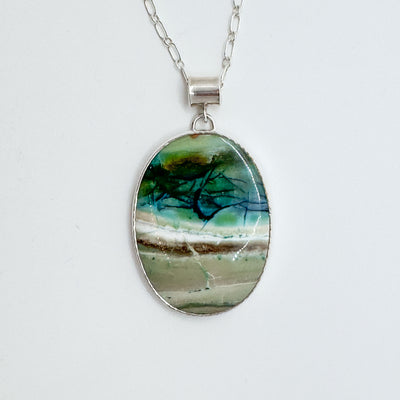 Bezel set large oval opalized wood pendant