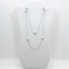 No Yolk with white pearls necklace