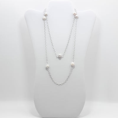 No Yolk with white pearls necklace