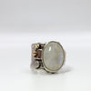 Deckled crotch hugger oval moonstone cabochon ring